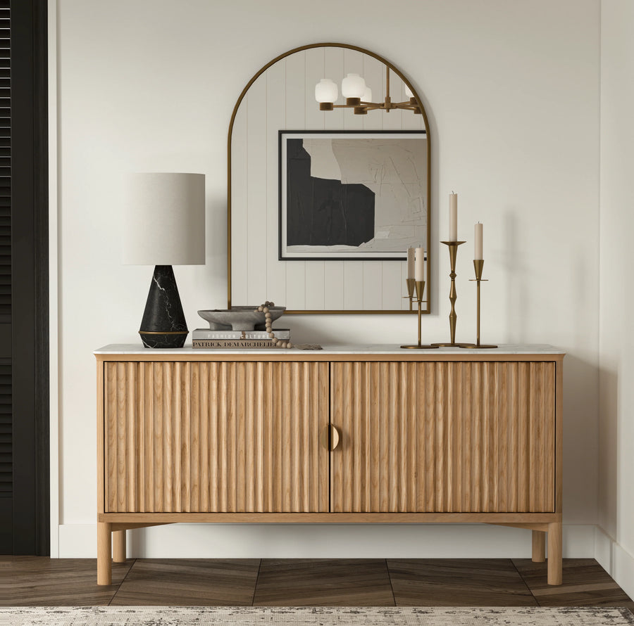 Wooden sideboard with decorative items in a room setting
