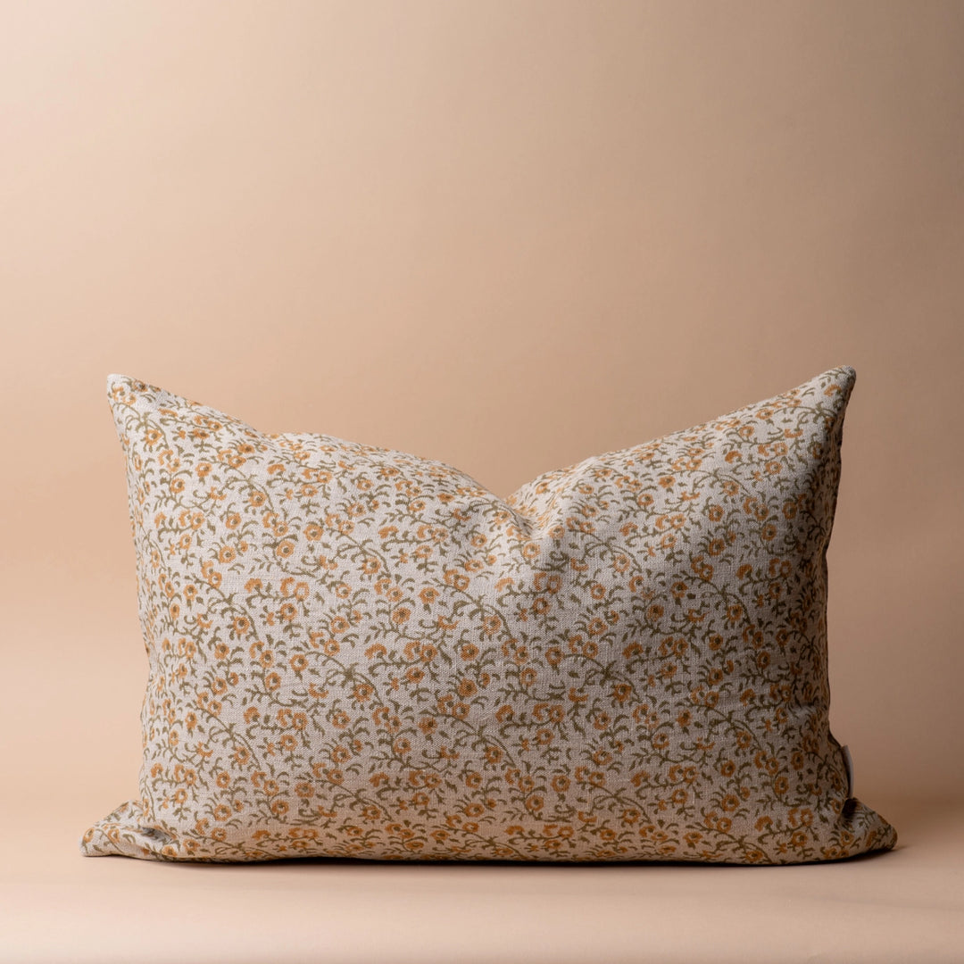 Floral-patterned pillow on a beige background